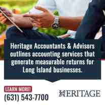 Business professionals reviewing financial data on a tablet during a consultation