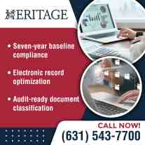 Business professional managing digital financial records and compliance documents on a laptop using organized electronic filing and reporting systems.