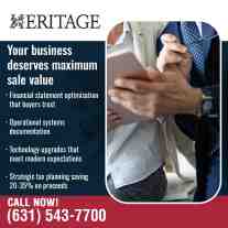 Business advisors reviewing financial data on a tablet.