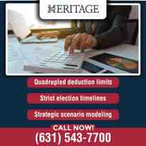 Accounting professional using a calculator and financial reports to develop PTET tax planning strategies, maximize deductions, and ensure timely compliance.
