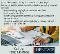 Accountant reviewing financial documents and calculations to strengthen internal controls